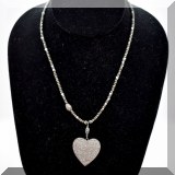 J126. Beaded necklace with pave diamond heart pendant. 